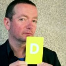 Mark Dowd holding a letter D