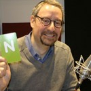 Rabbi Naftali Brawer in a radio studio with the letter N