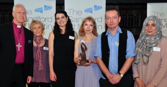 Kristine Pommert and the CTVC team receiving their Sandford St. Martin award