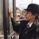 A Police Woman ringing a doorbell