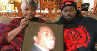 Mary and Oshea with a picture of Mary's son