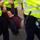 Rev Jo Rand being carried away by police