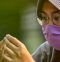 Woman in face mask and scarf